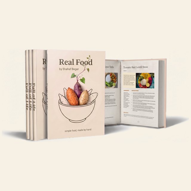 The Real Food e-book, shown as a printed book beside an open recipe page.