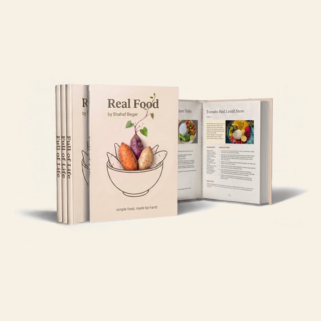 The Real Food e-book, shown as a printed book beside an open recipe page.